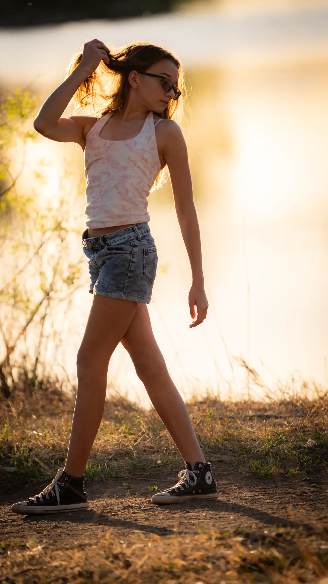 Lily Anna Zachman in a calm, reflective outdoor portrait.